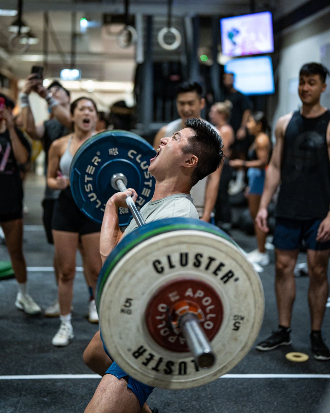 Athlete lifting a barbell during the Coastal Fitness in-house challenge