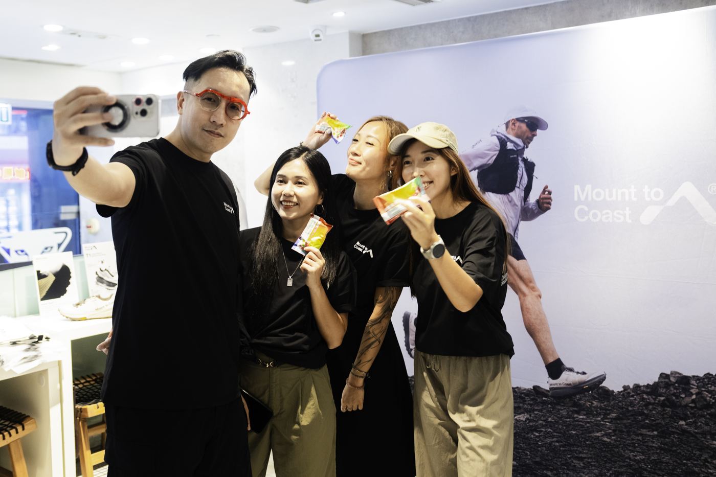 Team selfie at a Mount to Coast event booth
