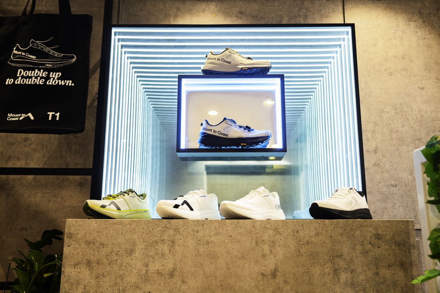 Mount to Coast T1 in-store display with lit shoe wall