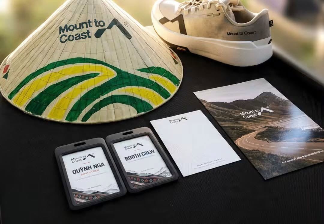 Mount to Coast booth kit in Vietnam with hand-painted conical hat, shoe and crew badges