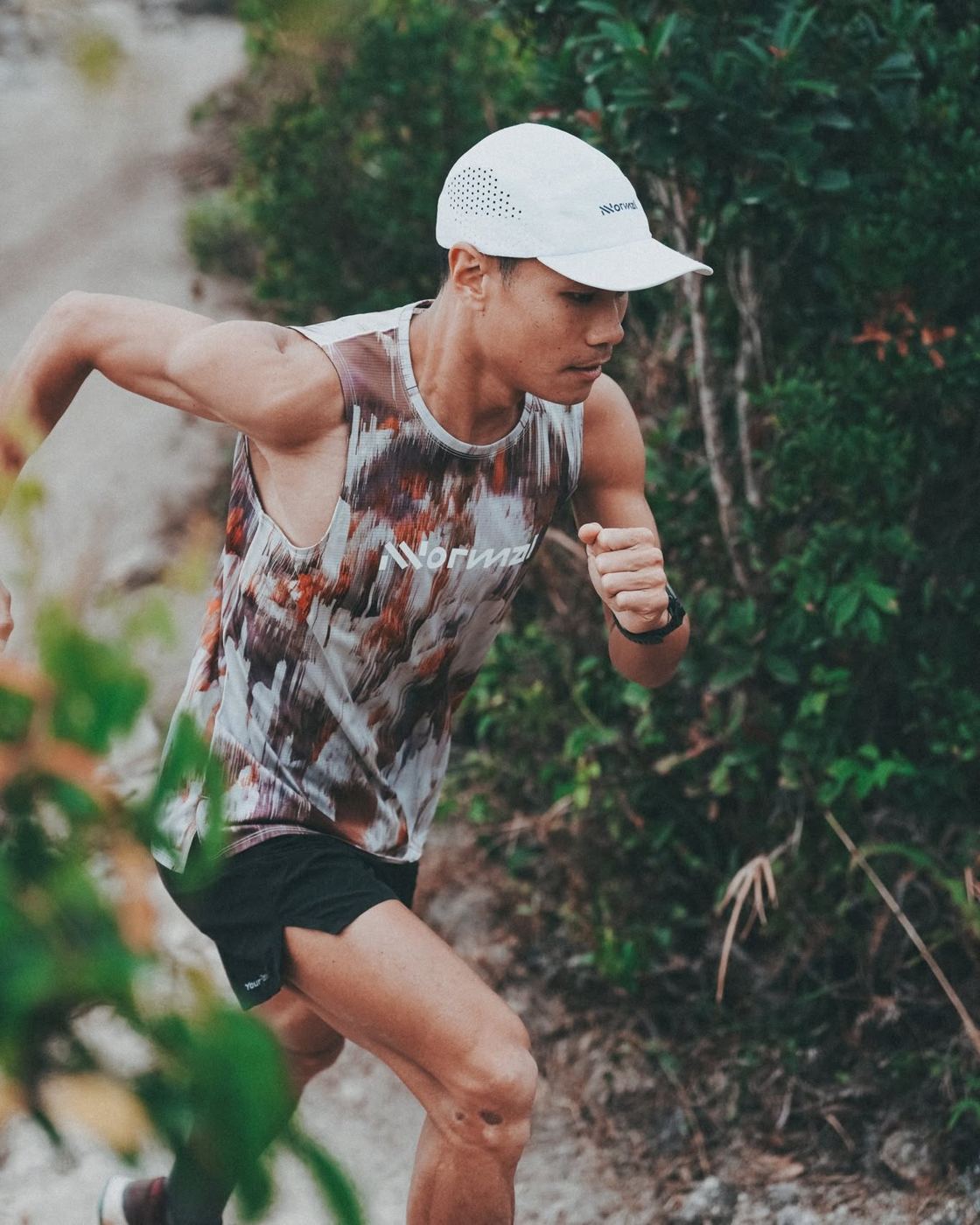 NNormal athlete running a rocky trail