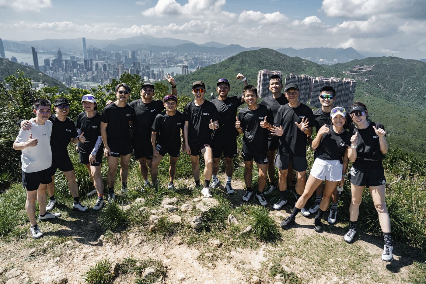 Mount to Coast T1 launch group on a Hong Kong hilltop with the harbour behind